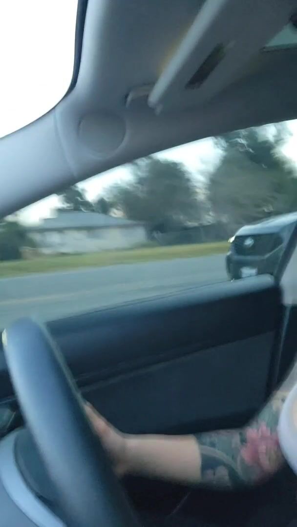 Tiddies out in the Tesla